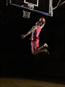 Basketball Player Slam Dunking